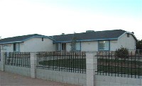 Custom home with wrought iron fence 11